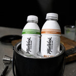 Two Midweek Mixers in a bucket of ice.