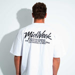 Person wearing a white t-shirt with 'Midweek' branding on the back 