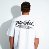 Person wearing a white t-shirt with 'Midweek' branding on the back 