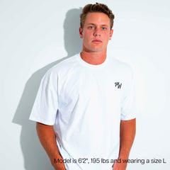 A man wearing a white short-sleeve crewneck t-shirt with a small black 'MW' logo on the left chest, set against a white background with a soft shadow.